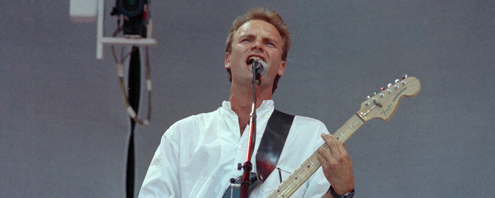 Musician Sting performs during the Live Aid benefit concert at Wembley stadium in London, England, July 13, 1985.  (AP Photo/Joe Schaber)