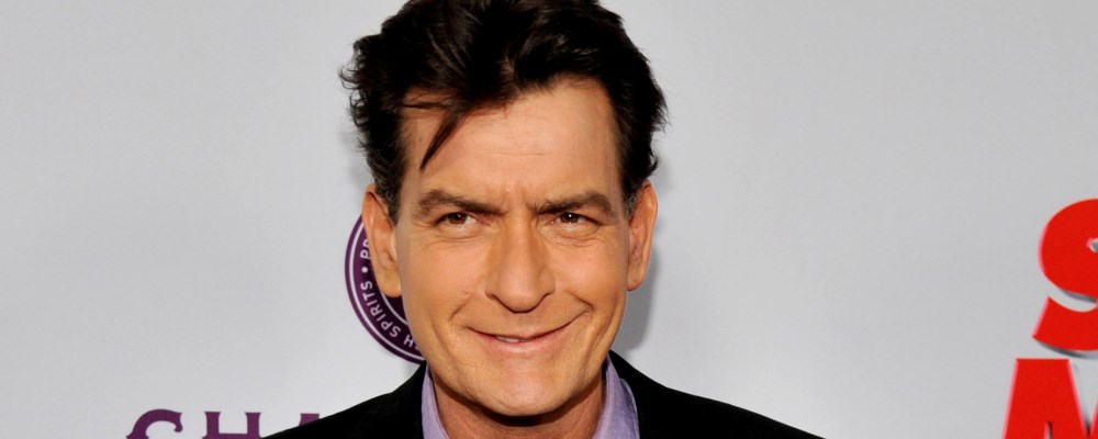 FILE - In this April 11, 2013 file photo, Charlie Sheen, a cast member in "Scary Movie V," poses at the Los Angeles premiere of the film at the Cinerama Dome in Los Angeles. Sheen was sued in Los Angeles Friday, Oct. 3, 2014, by a dental technician who claims the actor punched her in the chest and was abusive during an office visit in late September. (Photo by Chris Pizzello/Invision/AP, file)