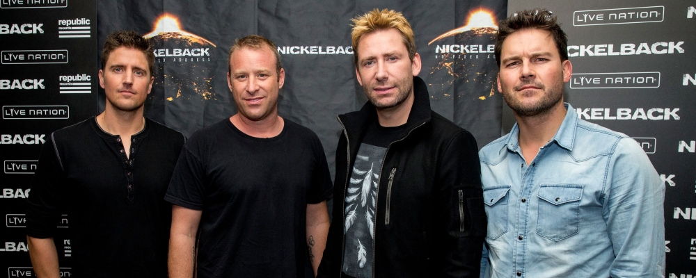 WEST HOLLYWOOD, CA - NOVEMBER 05: (L-R) Daniel Adair, Chad Kroeger, Mike Kroeger and Ryan Peake of Nickelback pose at the special announcement and live performance at the House of Blues on the Sunset Strip November 5, 2014 in West Hollywood, California. (Photo by Mark Davis/Getty Images)