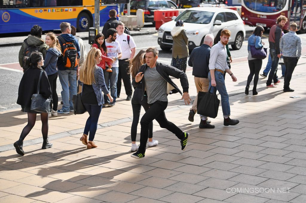 EDINBURGH, SCOTLAND - JULY 13:  Actors Ewan McGregor and Ewan Bremner run on the set of the Trainspotting film sequel on Princess Street on July 13, 2016 in Edinburgh, Scotland. The long awaited Trainspotting 2 is being filmed in Edinburgh and Glasgow, 20 years after the original was released and it will also see the cast from the first film returning including Ewan McGregor, Jonny Lee Miller and Robert Carlyle.  (Photo by Jeff J Mitchell/Getty Images)