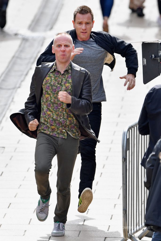 EDINBURGH, SCOTLAND - JULY 13:  Actors Ewan McGregor and Ewan Bremner run on the set of the Trainspotting film sequel on Princess Street on July 13, 2016 in Edinburgh, Scotland. The long awaited Trainspotting 2 is being filmed in Edinburgh and Glasgow, 20 years after the original was released and it will also see the cast from the first film returning including Ewan McGregor, Jonny Lee Miller and Robert Carlyle.  (Photo by Jeff J Mitchell/Getty Images)