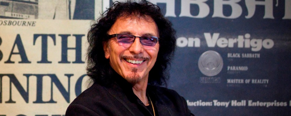 Black Sabbath's Tony Iommi in front of newspaper cuttings and posters from the band's early days at the opening night of the Home Of Metal exhibition at Birmingham Museum & Art Gallery. The show charts the birth and rise of Heavy Metal music in Birmingham. Informed by original band artefacts and materials from the Home of Metal digital archive, this exhibition brings together iconic items such as Black Sabbath’s Mob Rules stage cross, Judas Priest costumes and handwritten Napalm Death lyrics and places them alongside unseen memorabilia sourced directly from the fans. The show will also explore the ingredients that together made Heavy Metal, offering an insight into the region’s industrial history, the early blues-rock sound, the changing music industry, DIY politics as well as Heavy Metal’s global impact.